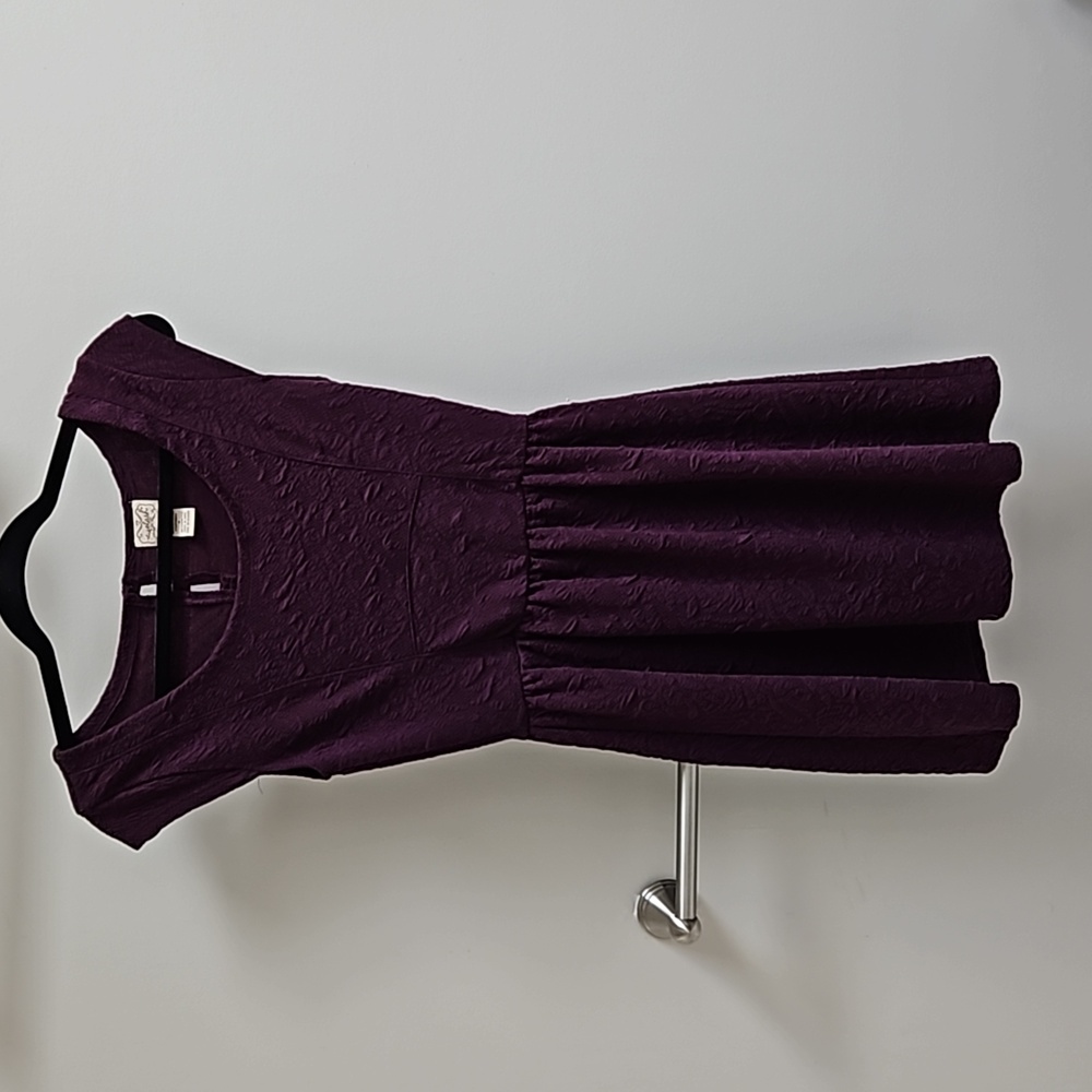 Purple dress.